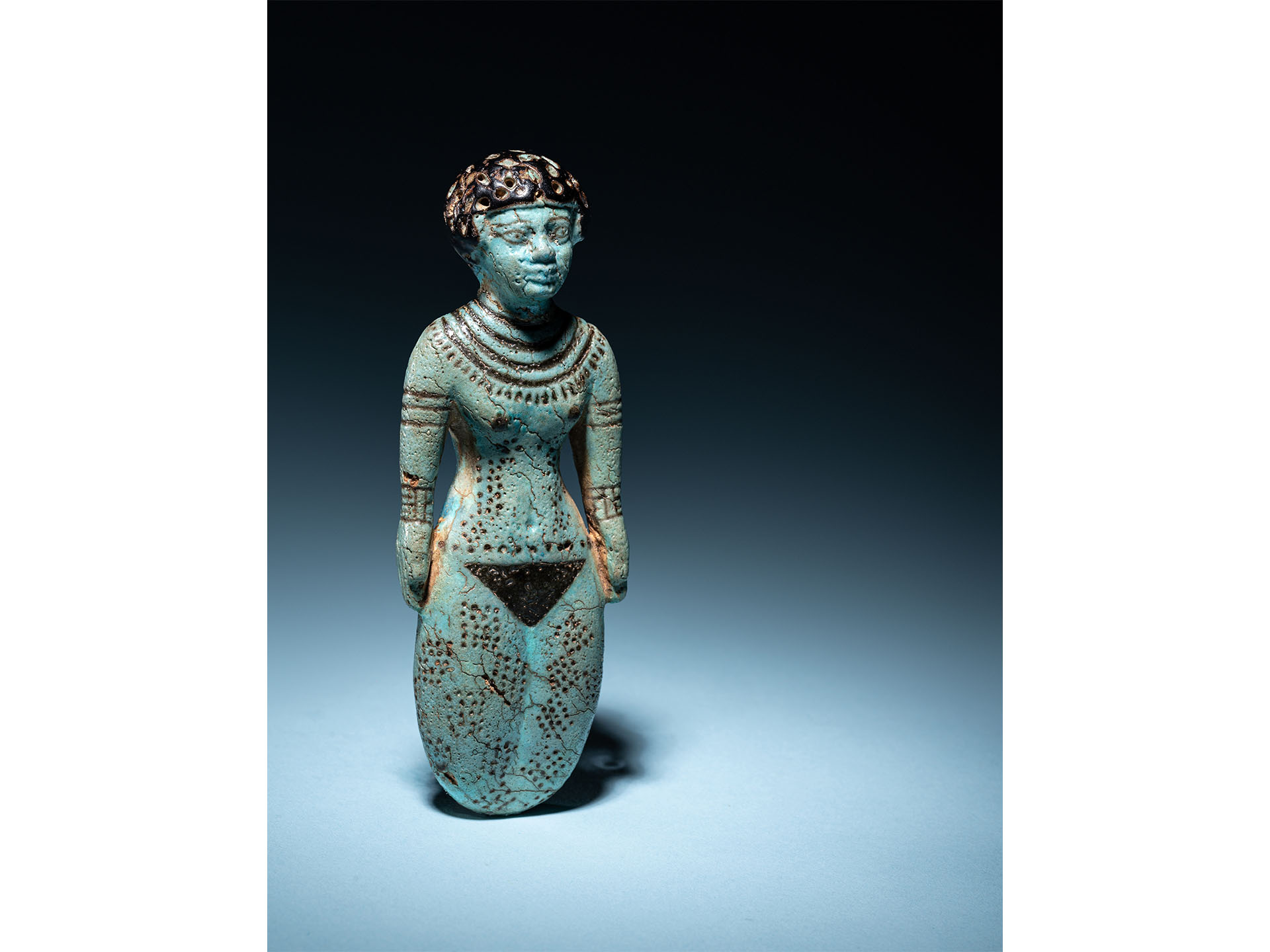 An Egyptian Faience Female Figure Middle Kingdom, 12th Dynasty, 1991-1783 B.C.